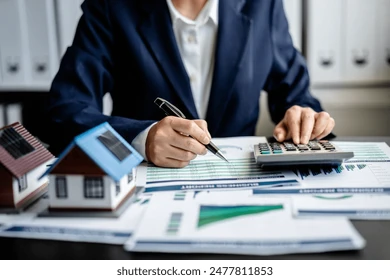 female-real-estate-broker-presenting-260nw-2477811853